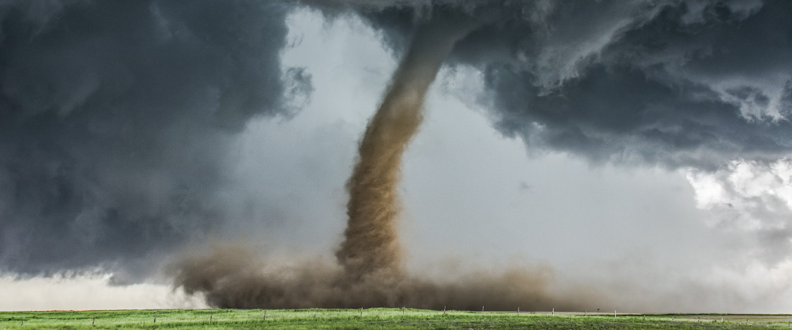 Image of a tornado in a field
