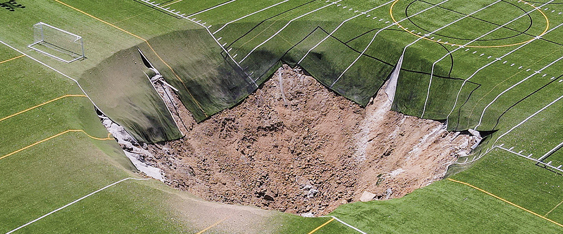 Bird&apos;s eye view of a sinkhole over athletic fields